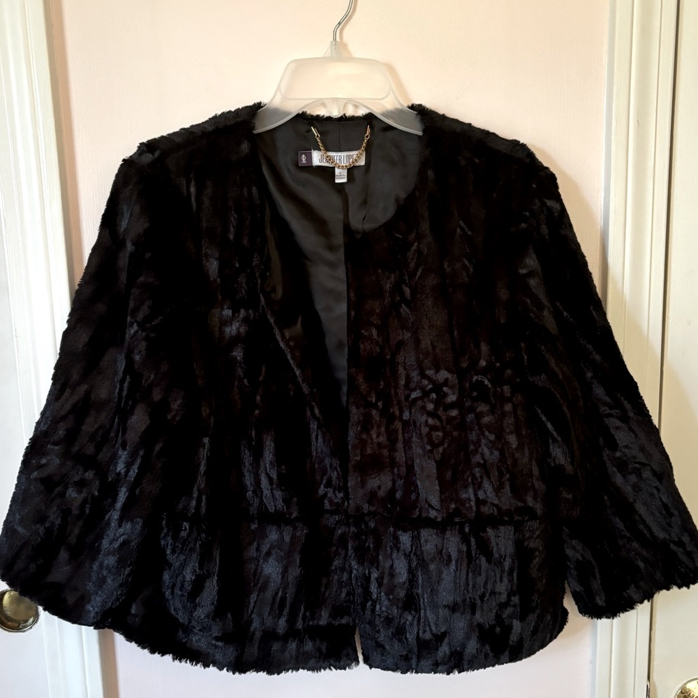 Never worn black faux fur 3/4 sleeve jacket by Jennifer Lopez, size large.